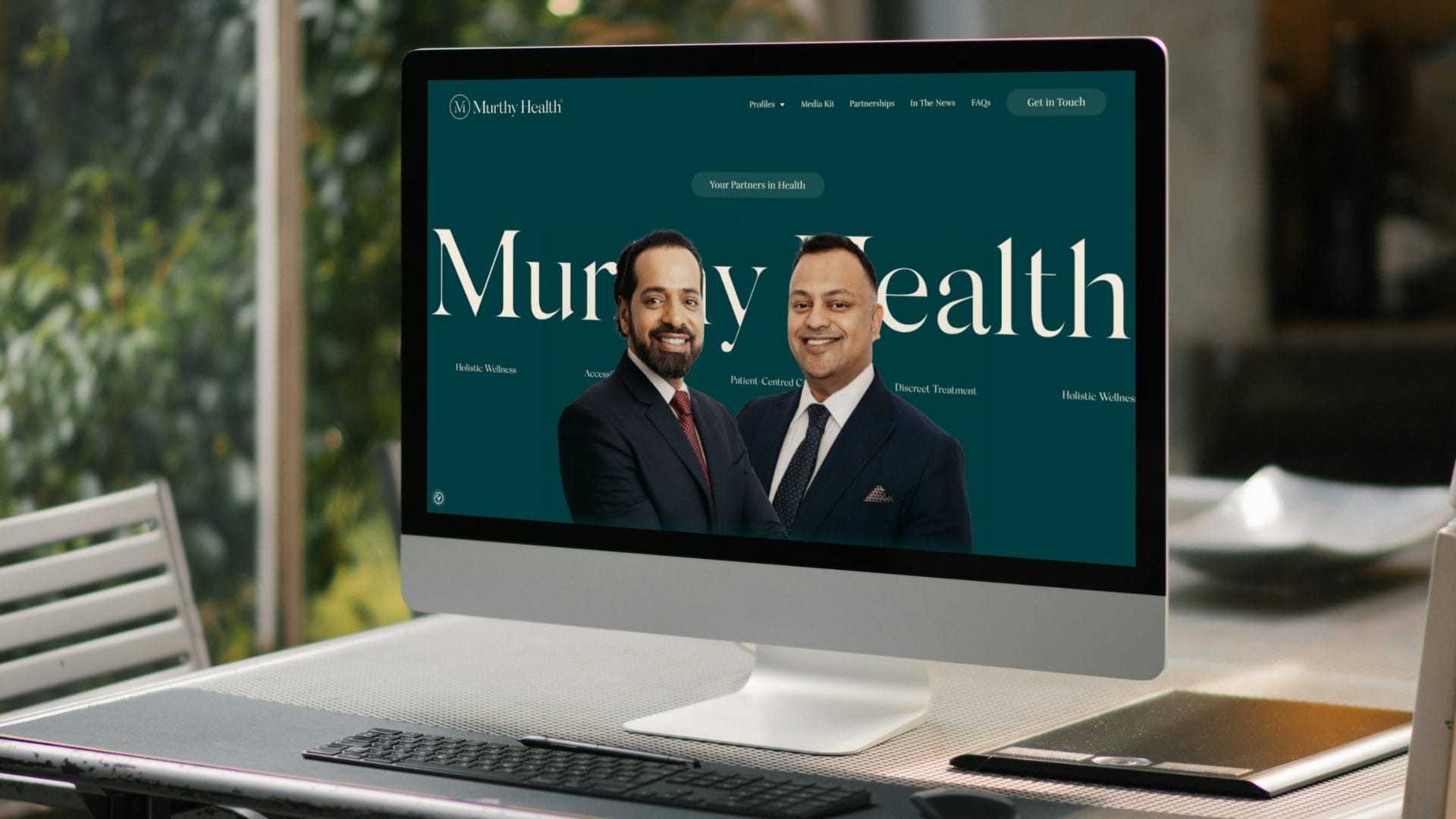 Murthy Health website home page shown on monitor